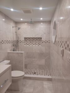 Modern standing shower bathroom remodel by Visionary Custom Creations featuring dual vanity, custom tile walls and floors, and a luxury shower in Bucks County, Pennsylvania.