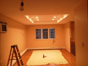 Luxury Living Room remodel with a custom tray ceiling by Visionary Custom Creations