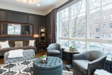 Luxury living room with custom moldings and large windows